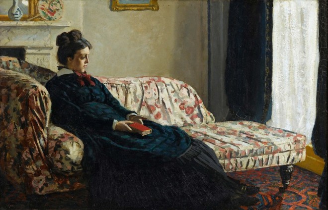 Madame Monet sitting on a sofa 1870